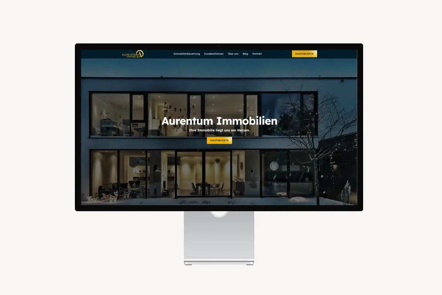 Aurentum Real Estate Webflow website on an Apple Studio Display
